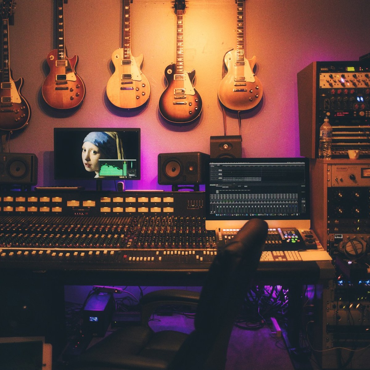 Professional mixing and mastering studio with console and monitors
